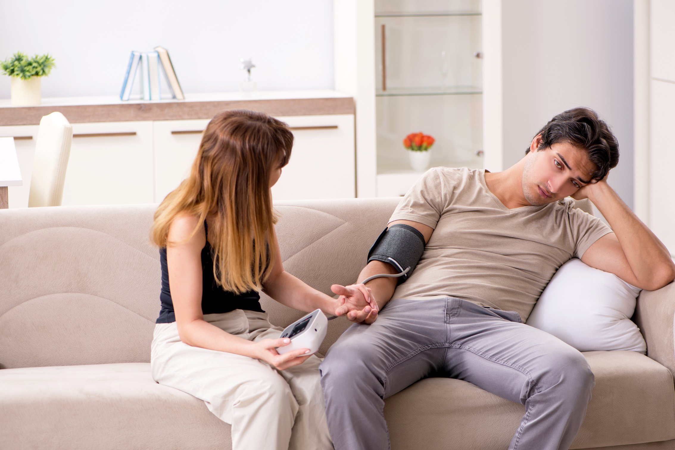 Wife Checking Husband's Blood Pressure